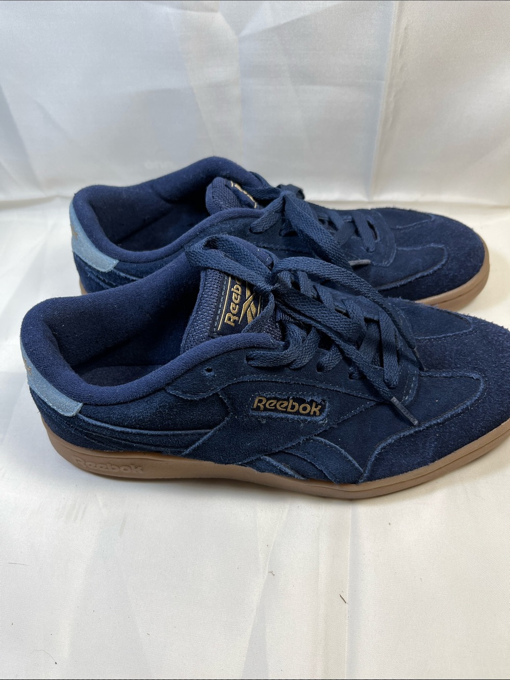 Reebok women’s Navy Suede Low-Top Sneakers with Gum Sole